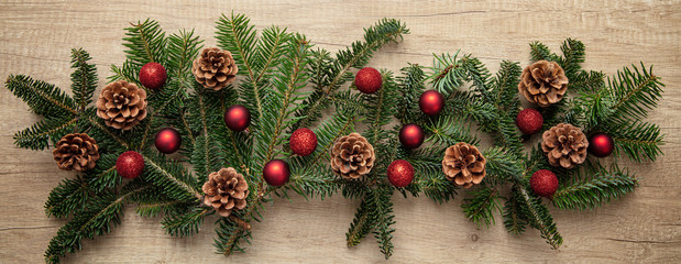 Fir twig fresh decoration against wooden background, banner