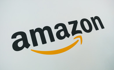 COLOGNE, GERMANY SEPTEMBER, 2017: Amazon Logo on a paper wall. Amazon is an American electronic e-commerce company distribution worlwide.