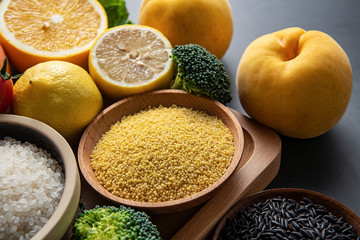 Yellow fresh seasonal fruits and vegetables and whole grains