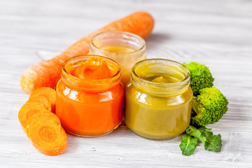 baby vegetable puree on wooden background
