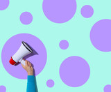 Person holding a megaphone with hard shadow