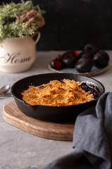 homemade plum crumble in cast iron
