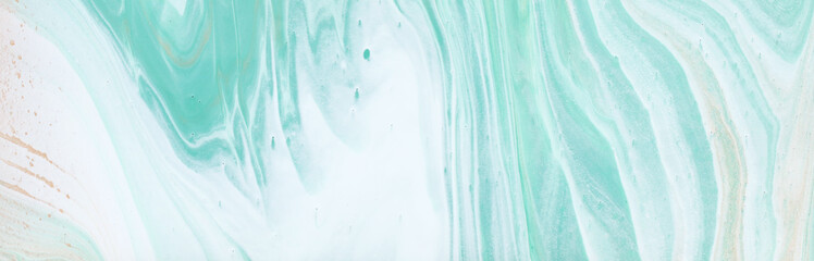 photography of abstract marbleized effect background. turquoise, gold, blue and white creative...