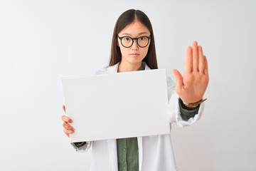 Young chinese dooctor woman wearing glasses holding banner over isolated white background with open...