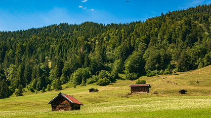 Beautiful alpine view with an agricultural hut near the Geroldsee and the famous Karwendel summit Mittenwald, Bavaria, Germany
