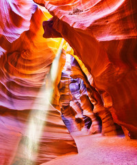 View of Upper Antelope Canyon with sunbeam shined into canyon at noon in early October in Arizona,...