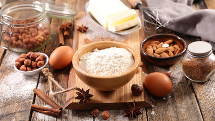 baking ingredient with flour, egg, nuts and spices