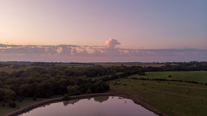 Storm clouds over rural Nebraska countryside and sunrise
