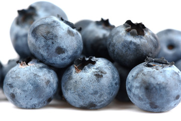 Macro shot. Blueberry berries over white background.