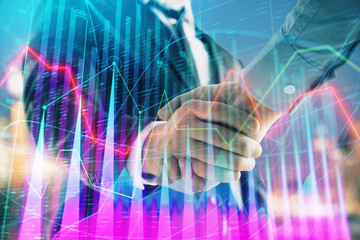 Double exposure of financial chart on cityscape background with two businessmen handshake. Concept of financial analysis and investment opportunities