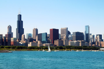 Fototapeta na wymiar Chicago downtown skyline with Michigan lake.Scenic summer cityscape with lakefront skyscrapers of Chicago with drifting yachts on the Michigan lake harbor. American urban city architecture background.