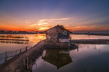 A small house in the middle of fields