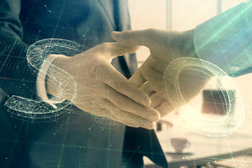 Multi exposure of seo icon hologram on office background with two men handshake. Concept of data...