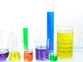 Laboratory glassware with colorful chemical reagent in research laboratory 