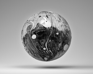 An abstract 3d render of a metal planet black and white, half black sphere and half white. 