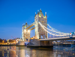 Fototapeta na wymiar Famous place in London, Tower Bridge over Thames river illuminated at dusk to down in England