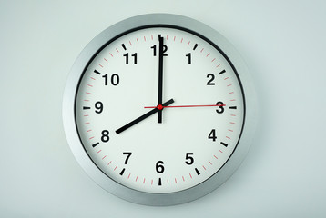 Gray wall clock face beginning of time 08.00 am or pm on White background, Copy space for your text, Time concept.