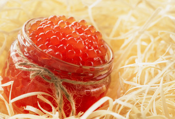 tasty and healthy red caviar in a glass jar