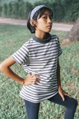 portrait of Asian  little girl a pose in the park