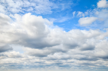 Blue sky covered with clouds. Image for backgrounds.
