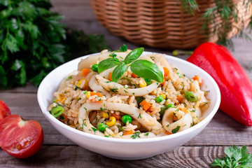 Fried squid with rice and vegetables
