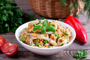 Fried squid with rice and vegetables