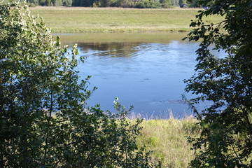 by the river on a clear summer day