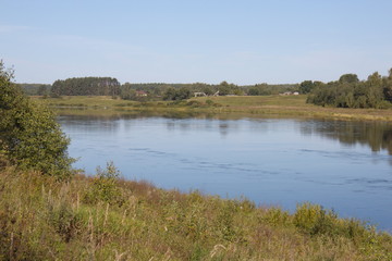 by the river on a clear summer day