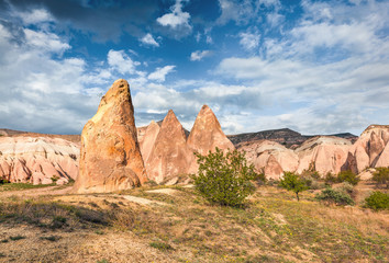 Fototapeta na wymiar Captivating spring scene of Cappadocia. Picturesque morning view of of Red Rose valley in April. Cavusin village located, district of Nevsehir, Turkey, Asia. Traveling concept background.