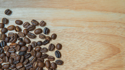 Coffee beans on the table. Picture at top view. Isolated on white background. Clipping path is included.