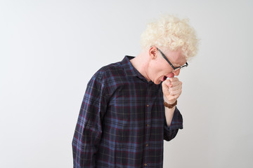 Young albino blond man wearing casual shirt and glasses over isolated white background feeling unwell and coughing as symptom for cold or bronchitis. Healthcare concept.