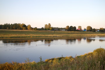 Fototapeta premium by the river in the countryside on a summer evening