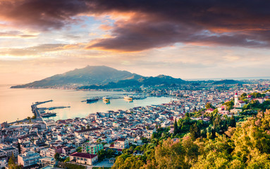 Fototapeta na wymiar Aerial view of Zakynthos (Zante) town. Dramatic spring sunrise on Ionian Sea. Beautiful cityscape panorama of Greece city. Traveling concept background. Artistic style post processed photo.