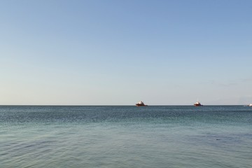 Fototapeta premium Fishing trawlers navigating off the coast of Antofagasta, Chile.