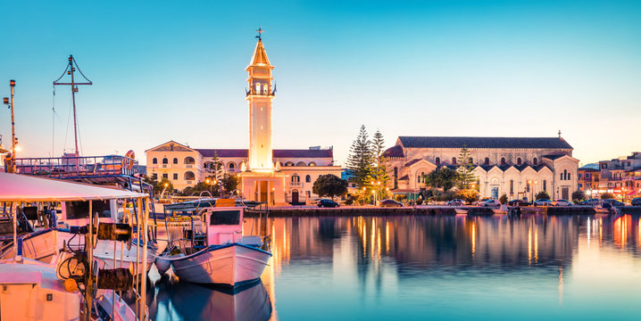 Amazing spring sunset in Zakynthos city. Beautiful evening panorama of town hall and Saint Dionysios Church, Ionian Sea, Zakynthos island, Greece, Europe. Traveling concept background.