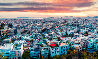 Fototapeta na wymiar Aerial evening view of Athens, capital of Greece, Europe. Splendid spring sunset in the big sity. Traveling concept background. Artistic style post processed photo.