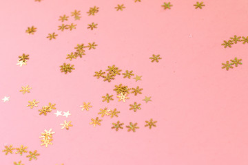 Shiny gold snowflakes pattern on bright pink background, Christmas greeting card design template with space for text