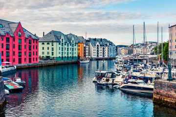 Fototapeta premium Splendid summer view of Alesund port town on the west coast of Norway, at the entrance to the Geirangerfjord. Colorful morning cityscape. Traveling concept background.
