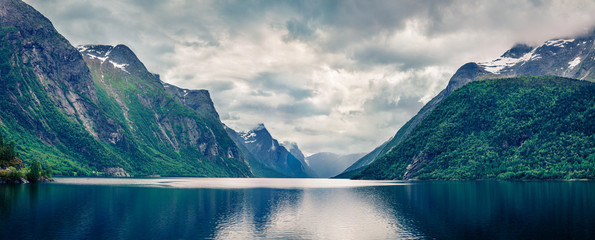 Dramatic summer panorama of Eikesdalsvatnet lake, Nesset Municipality in More og Romsdal county. Fantastic morning scene of Norway, Europe. Beauty of nature concept background.