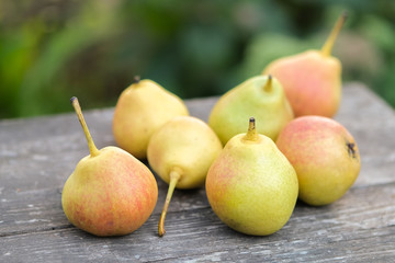 fresh pears on wooden table