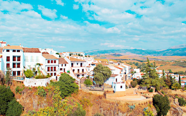 Houses in the hill of the valley of Ronda in the spanish village of  Malaga in a sunny day.