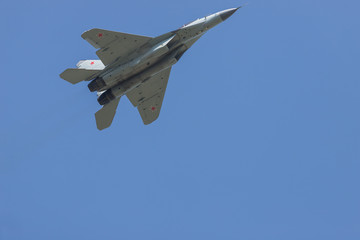 Fototapeta na wymiar A military fighter jet flying in the sky
