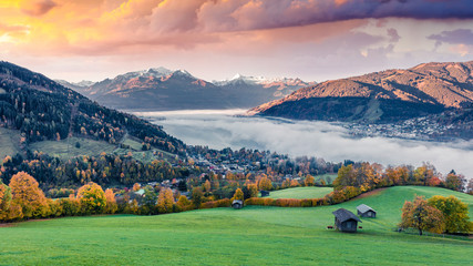 Unbelievable morning panorama of Zell lake. Dreamy autumn sunrise view of Austrian town - Zell am...