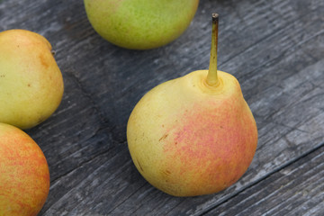 ripe pears on wooden table