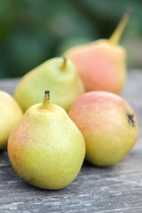 fresh pears on wooden table