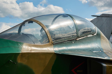 Jet fighter at the airport. The pilot's cockpit closeup