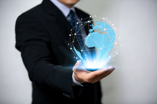 Digital Composite Image Of Businessman touch and Holding Digital global network
