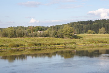 River banks and sky with cumulus clouds