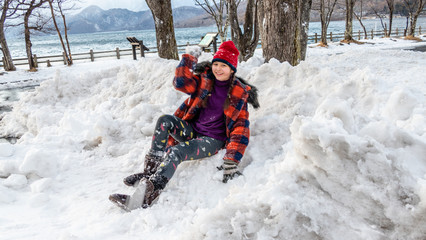Young girl having fun in snow