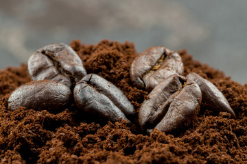 coffee beans in ground coffee close-up